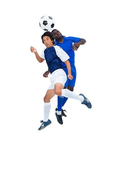 two soccer player jumping for a header (playing soccer FAQ)