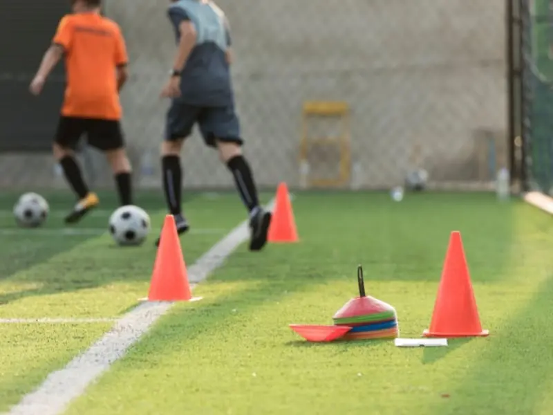 Soccer Training Session Around Equipment
