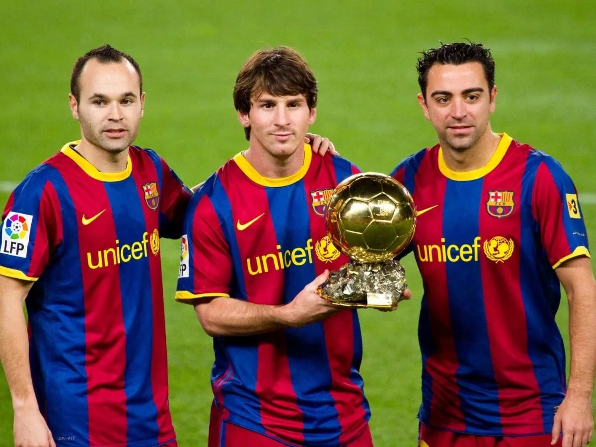 Andres Iniesta Leo Messi and Xavi Hernandez offering the FIFA World Player Award to the Barcelona soccer supporters. January 12 2011 in Nou Camp stadium Barcelona Spain. ○ Soccer Blade