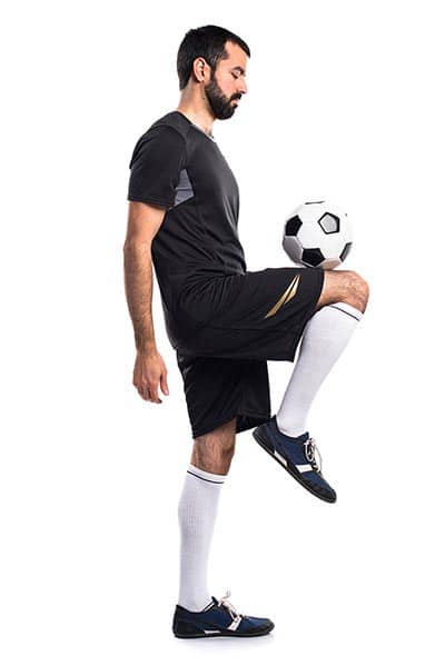 Juggling a soccer ball on a knee