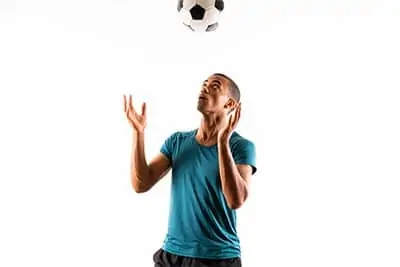 Soccer player juggling with head
