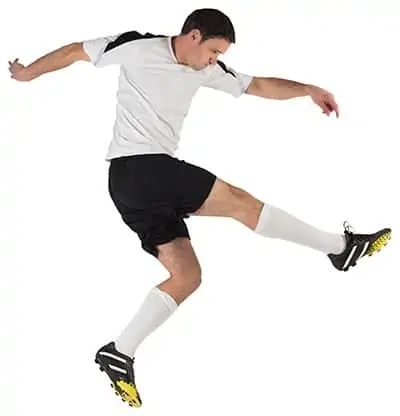 profile of soccer player after striking the ball