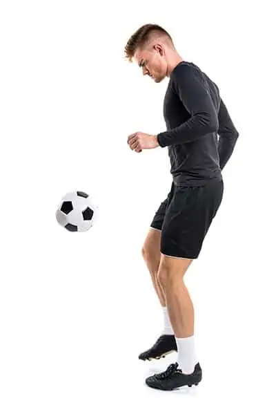 soccer player juggling the ball