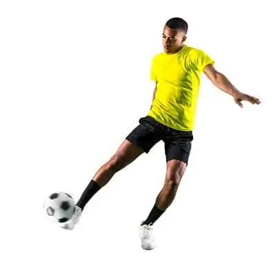 soccer player stretching to strike the ball (playing soccer FAQ)