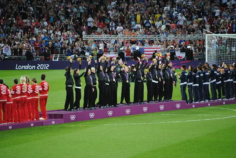 Soccer at the Olympics US Womens lifting trophy and medals