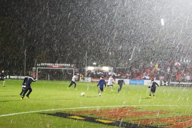 soccer game with heavy rain