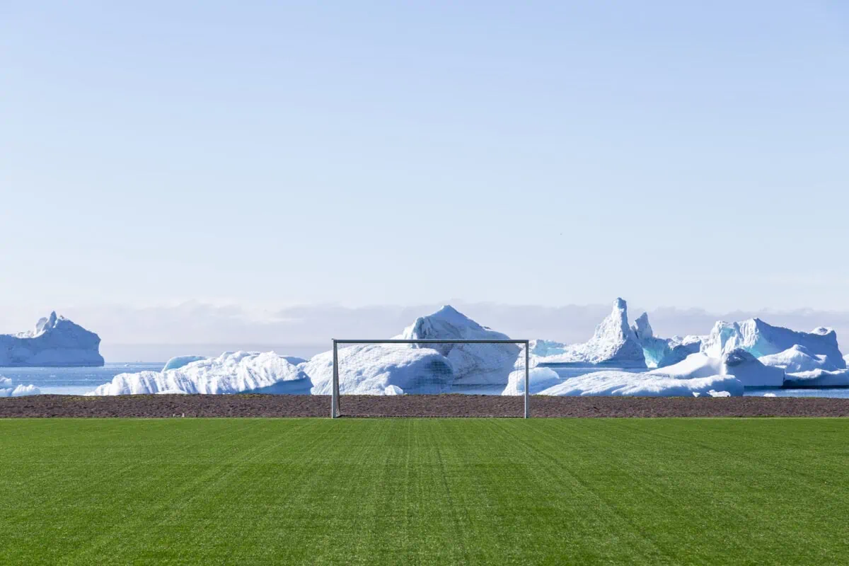Qeqertarsuaq Greenland July 6 2018 The soccer field with icebergs in the background. ○ Soccer Blade