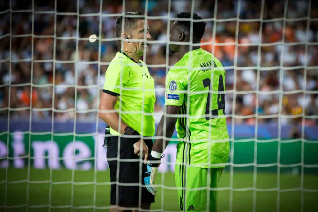 VALENCIA, SPAIN - OCTOBER 02, 2019 Referee talks with Onana during UEFA Champions League match between Valencia CF and AFC Ajax at Mestalla Stadium