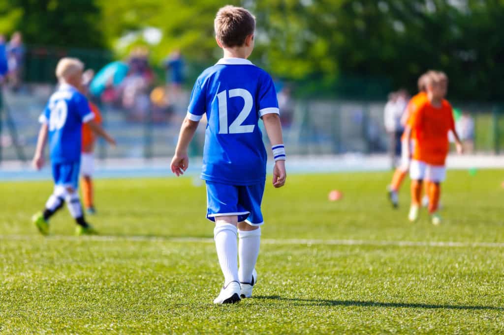 Youth Soccer Players Playing A Game On The Field