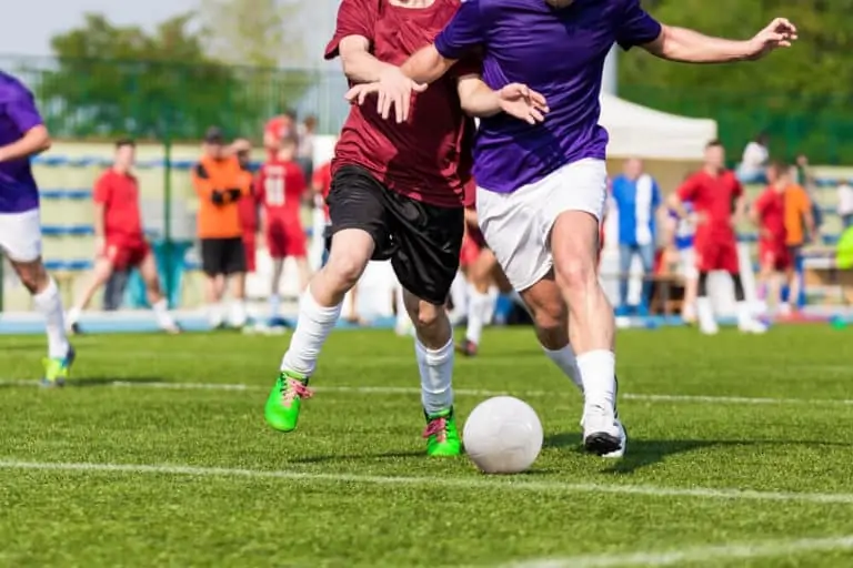 Youth Soccer Players - Two players battling for the ball