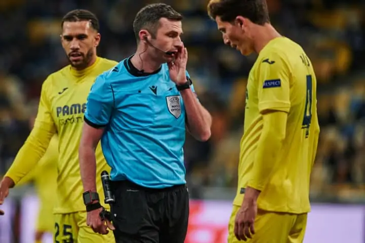 KYIV, UKRAINE - MARCH 11, 20214 defender Pau Torres talking with referee during the match of UEFA Europa League Dynamo Kyiv vs Villarreal at NSC Olympic in Kyiv