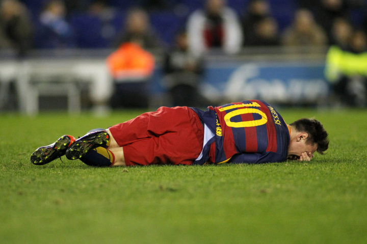 Leo Messi of FC Barcelona - Injured on the turf