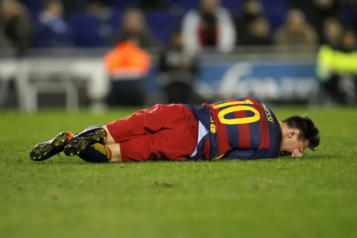 Leo Messi of FC Barcelona - Injured on the turf