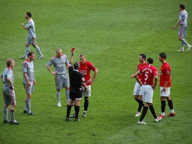 Referee Alan Wiley shows Nemanja Vidic of Man Utd a Red Card. Premier League match at Old Trafford between Manchester United FC and Liverpool FC on 14 March 2009. Manchester United 1 Liverpool 4