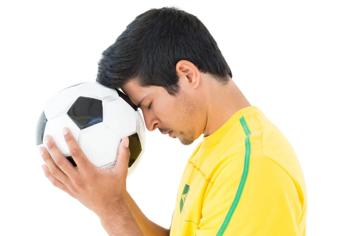 Player holding a soccer ball with closed eyes. ○ Soccer Blade