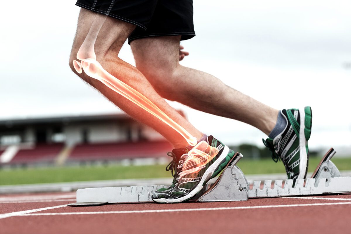 Digital composite of Highlighted knee of man about to race. ○ Soccer Blade