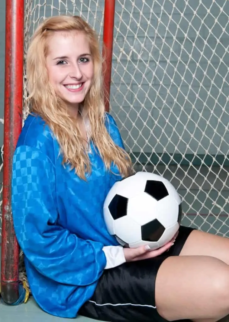 Soccer photo shoot with a ball in a goal