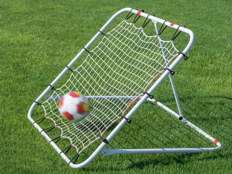 Soccer rebounder net ball hitting the net