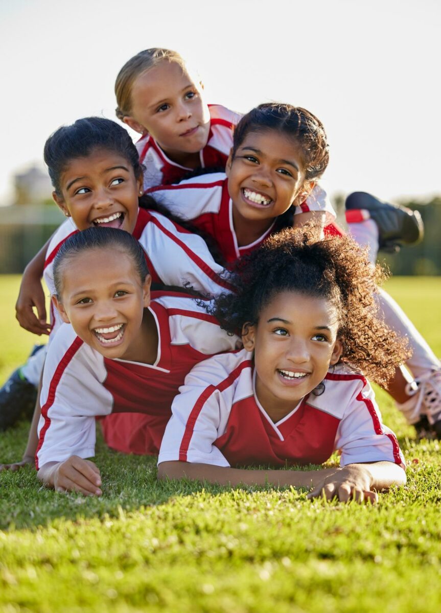 Team children and happy on field in sports after win in match game or competition. ○ Soccer Blade