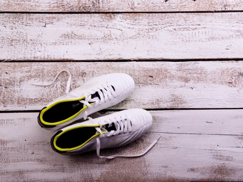 White Soccer cleats on a table