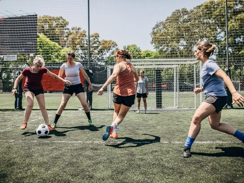 Girls playing a soccer