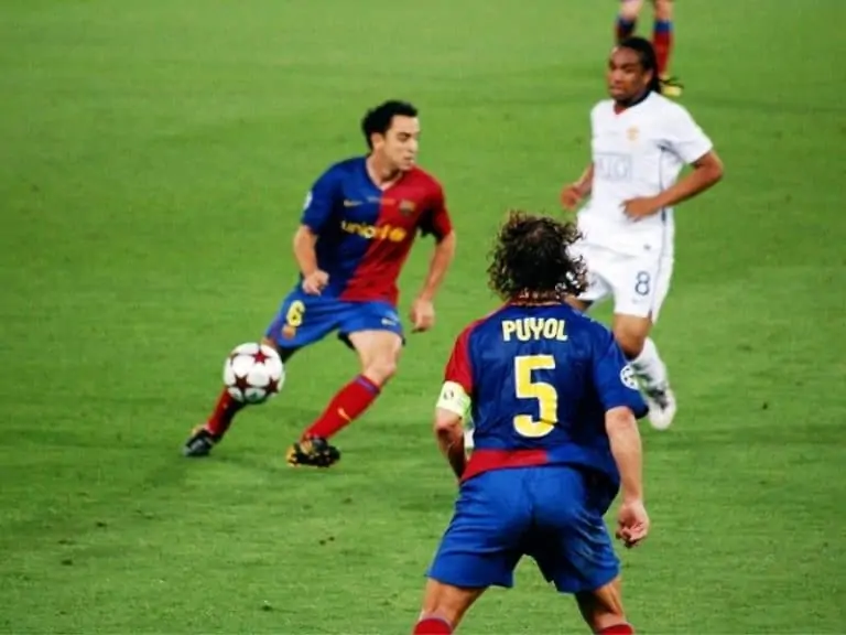 Barcelona FC. Puyol in sight taking a pass from Xavi during the 2009 UEFA Champions League Final in Rome Italy