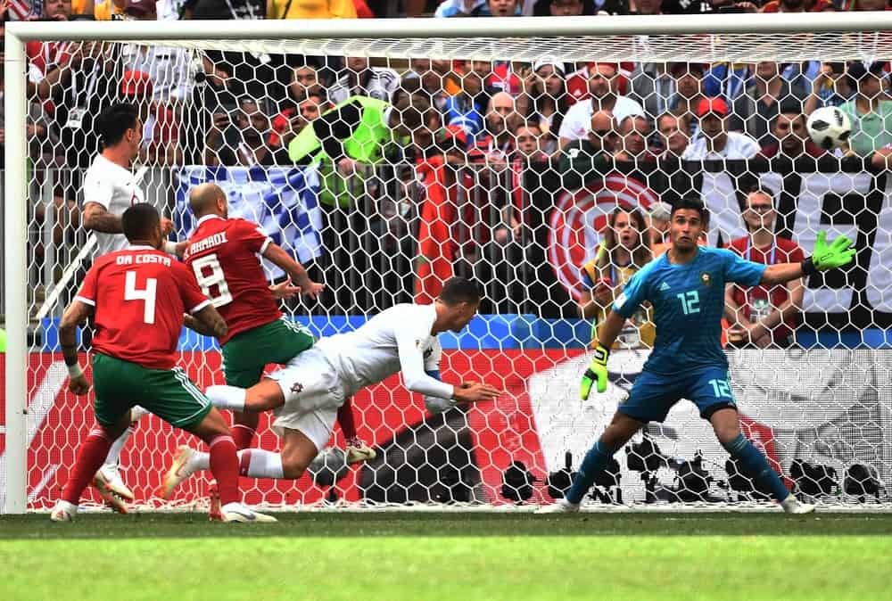Cristiano Ronaldo of Portugal center scores a goal against Morocco in their Group B match during the 2018 FIFA World Cup in Moscow Russia 20 June 2018