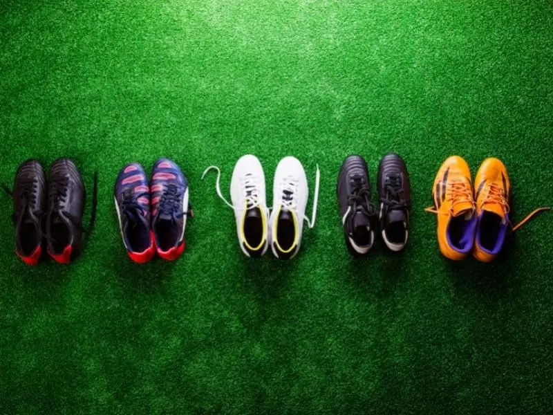 Soccer cleats from above on turf