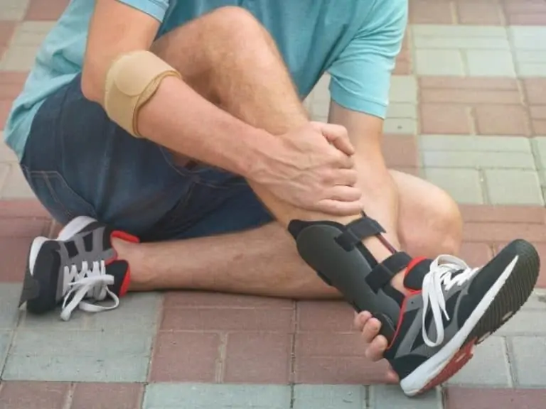 Soccer player with orthotics removing a sneaker
