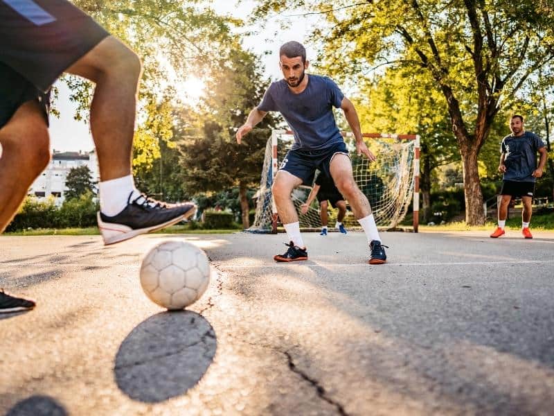 Street soccer with two men