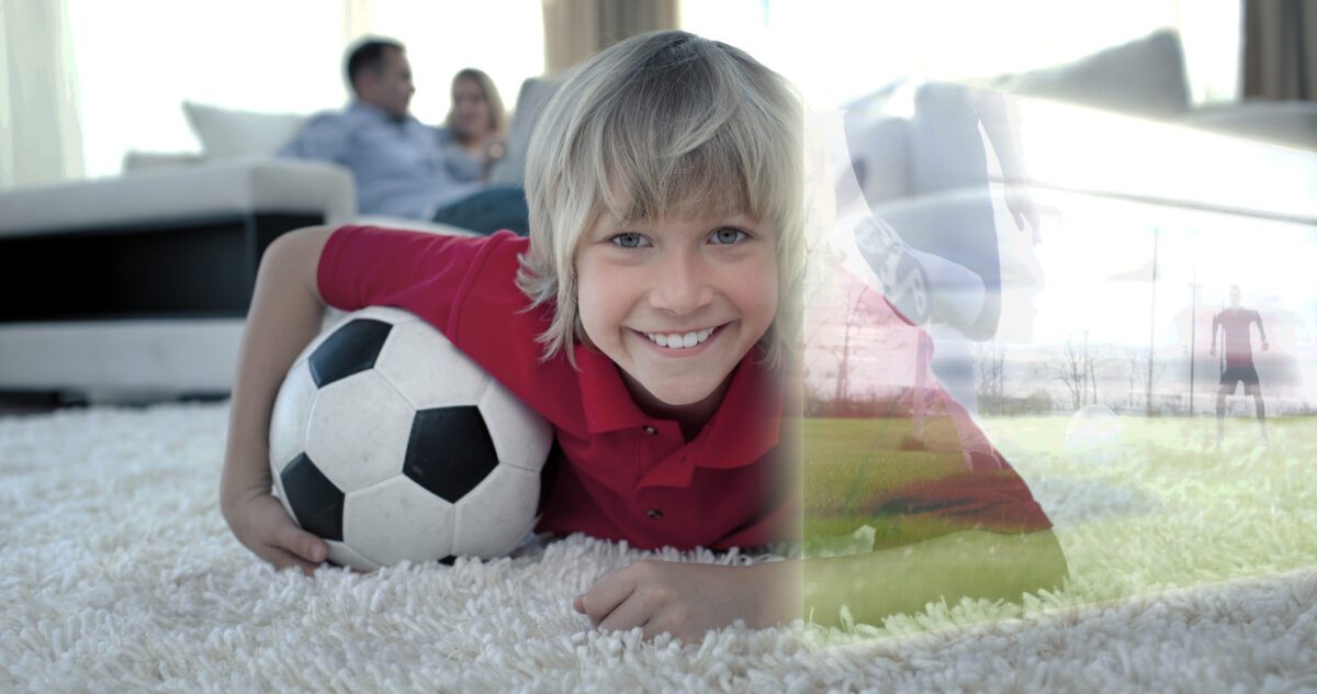 Composite image of cute soccer fan is watching soccer match on television at home. ○ Soccer Blade