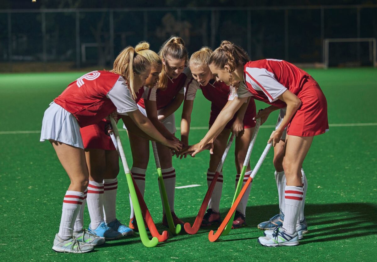 Hockey together hands and women teamwork support or motivation for game competition or training strategy communication. Leadership sports and group hand stack circle in target goal collaboration. ○ Soccer Blade