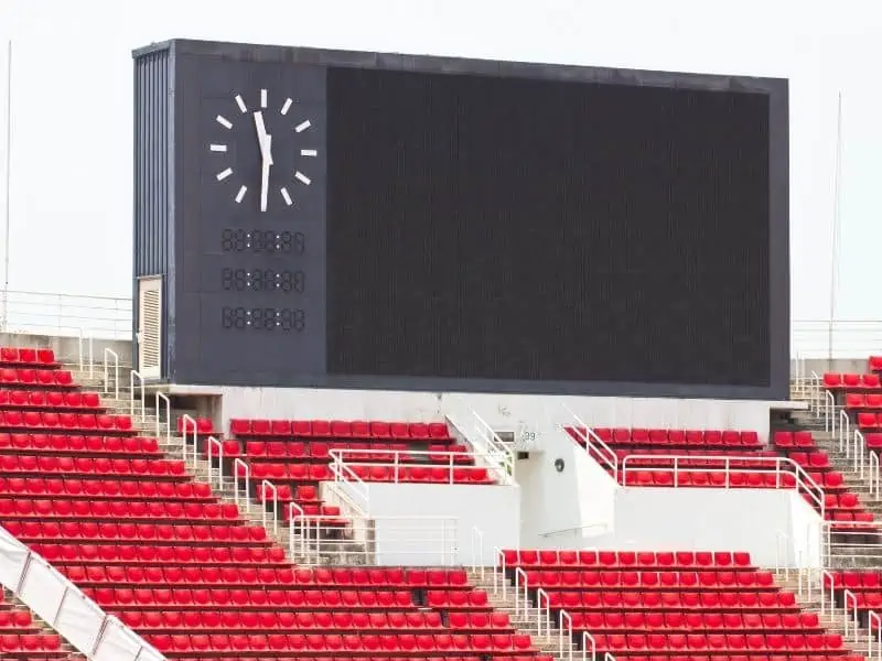 Soccer stand and scoreboard with clock