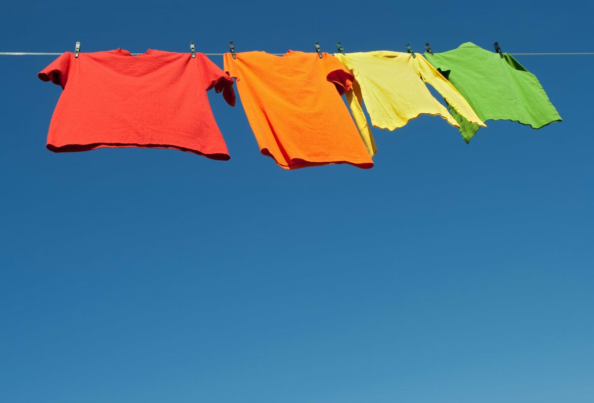 Bright clothes on a laundry line and blue sky. ○ Soccer Blade
