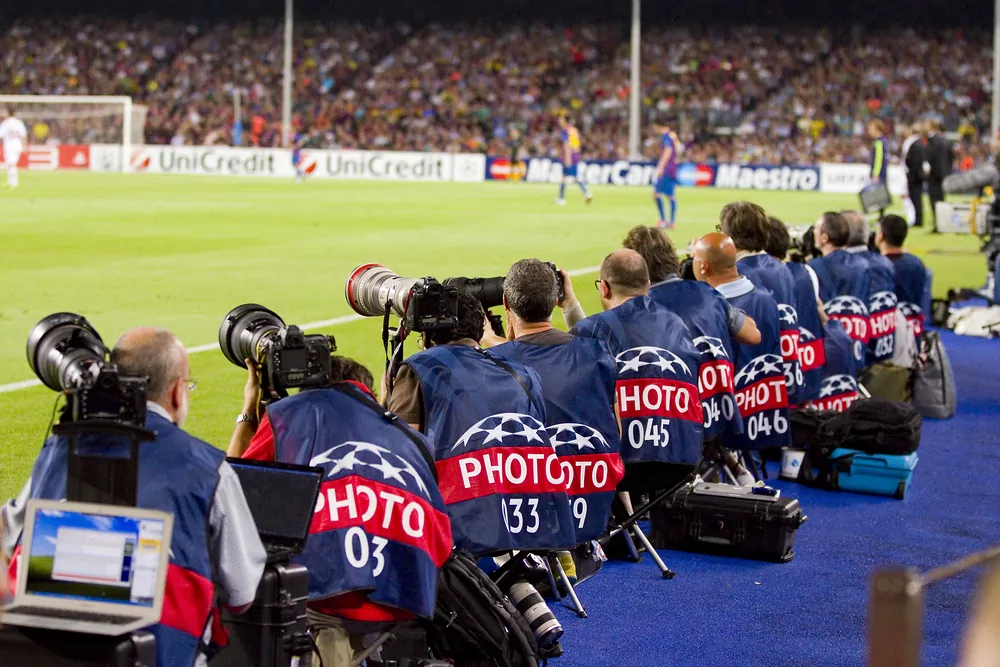 Some unidentified photographers working at the Champions League match between FC Barcelona and AC Milan 2 2 on September 13 2011 in Camp Nou Barcelona Spain.