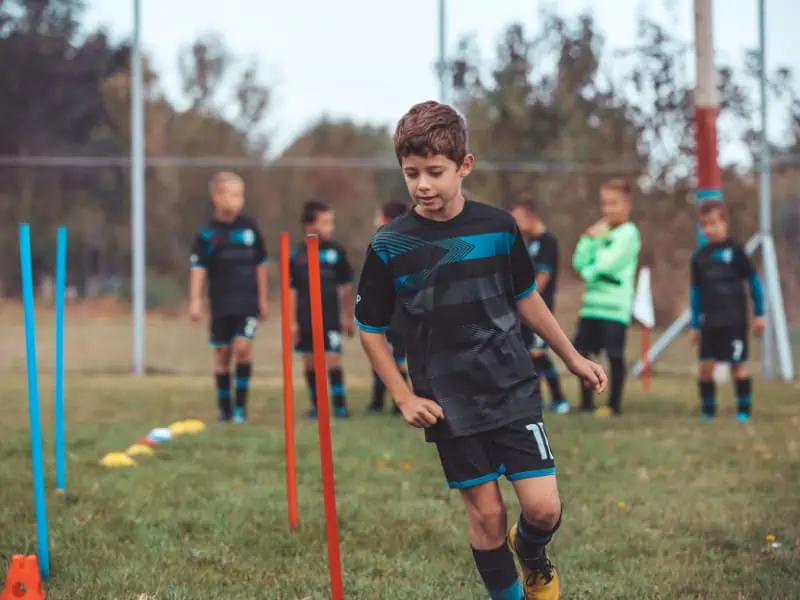 youth soccer team doing agility