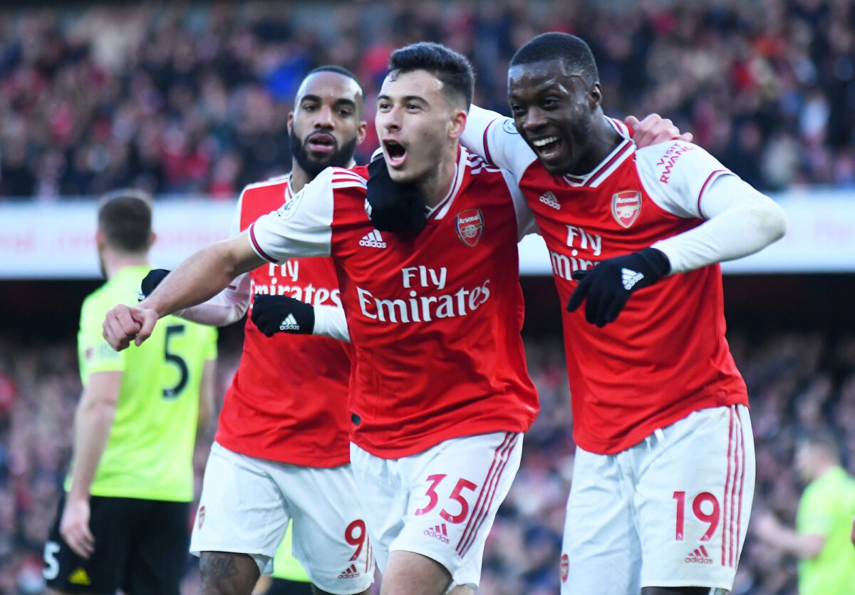 Gabriel Martinelli of Arsenal celebrates Nicolas Pepe of Arsenal after he scored a goal during the Premier League game between Arsenal FC and Sheffield United FC at Emirates Stadium. JANUARY 18 2020 ○ Soccer Blade