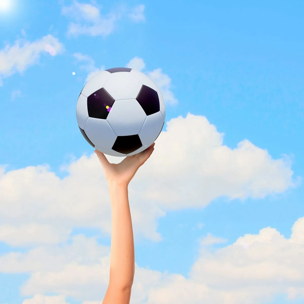 Close up image of hand holding soccer ball. ○ Soccer Blade