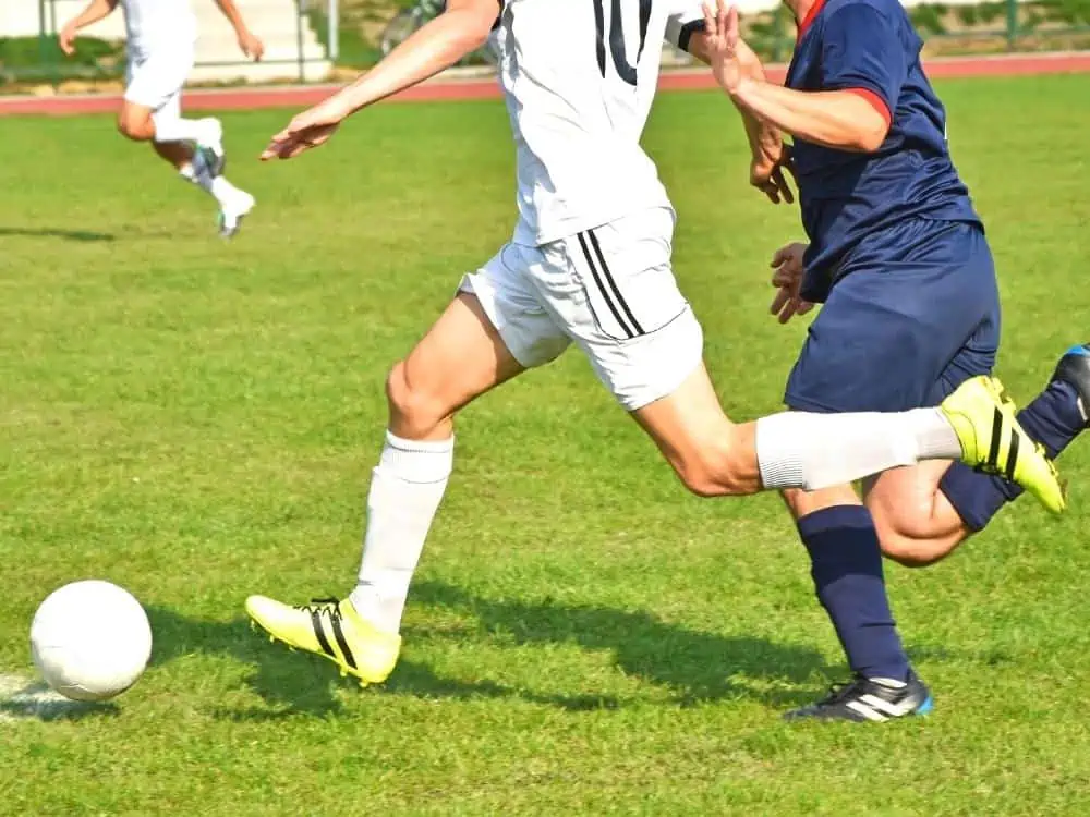 Soccer player breaking through the lines in a game