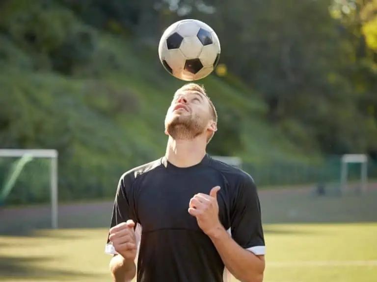 Soccer player controlling a ball with his head
