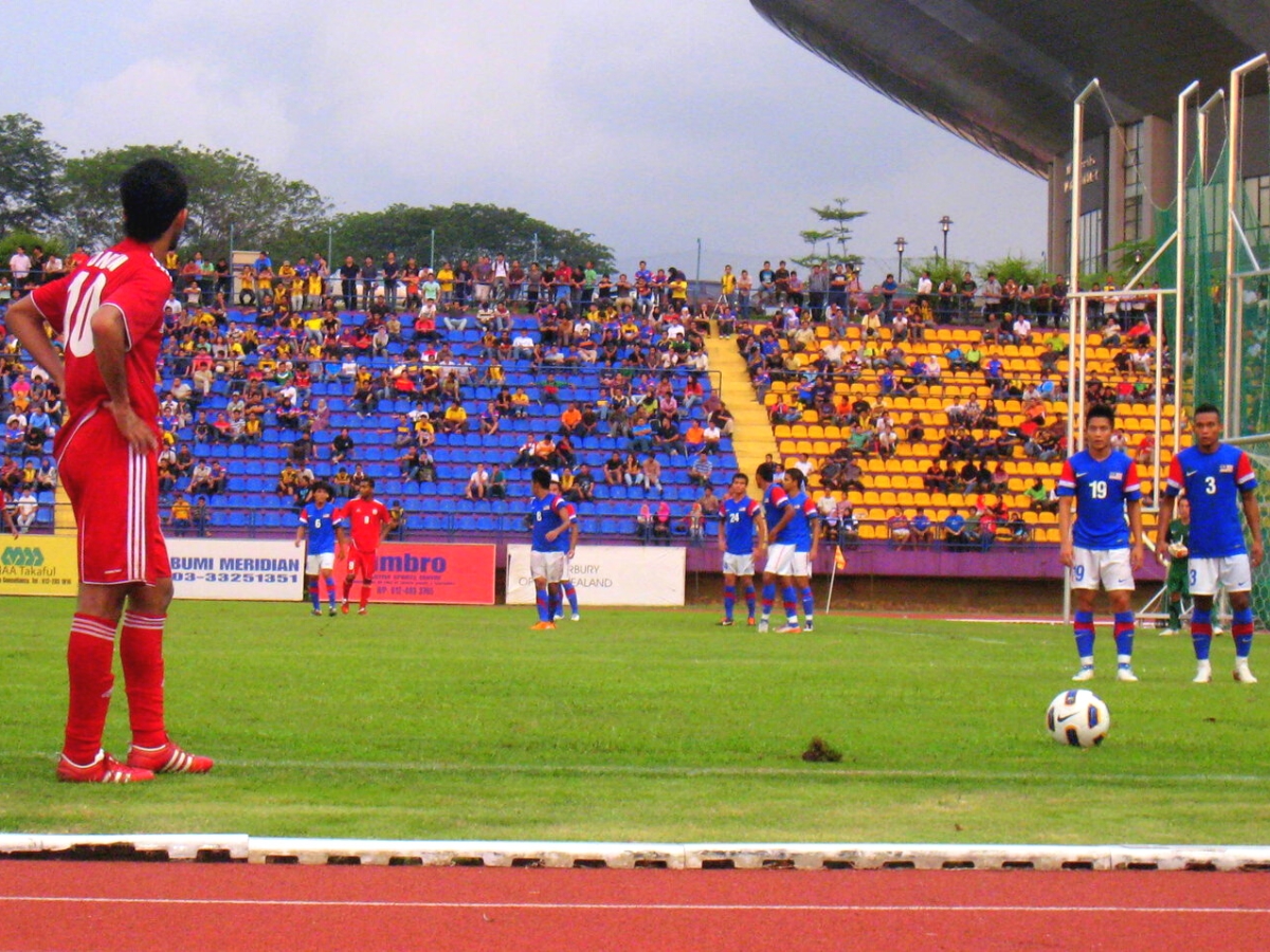 Free kick during a friendly game between Malaysia and Qatar at UiTM Shah Alam Stadium Malaysia. ○ Soccer Blade
