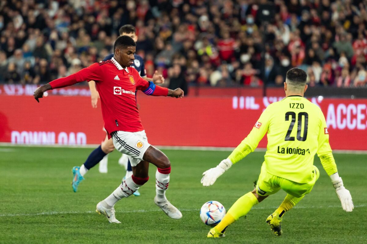 MELBOURNE AUSTRALIA JULY 15 Marcus Rashford of Manchester United runs with the ball and scores against Melbourne Victory in a pre season friendly football match at the MCG on 15th July 2022. ○ Soccer Blade