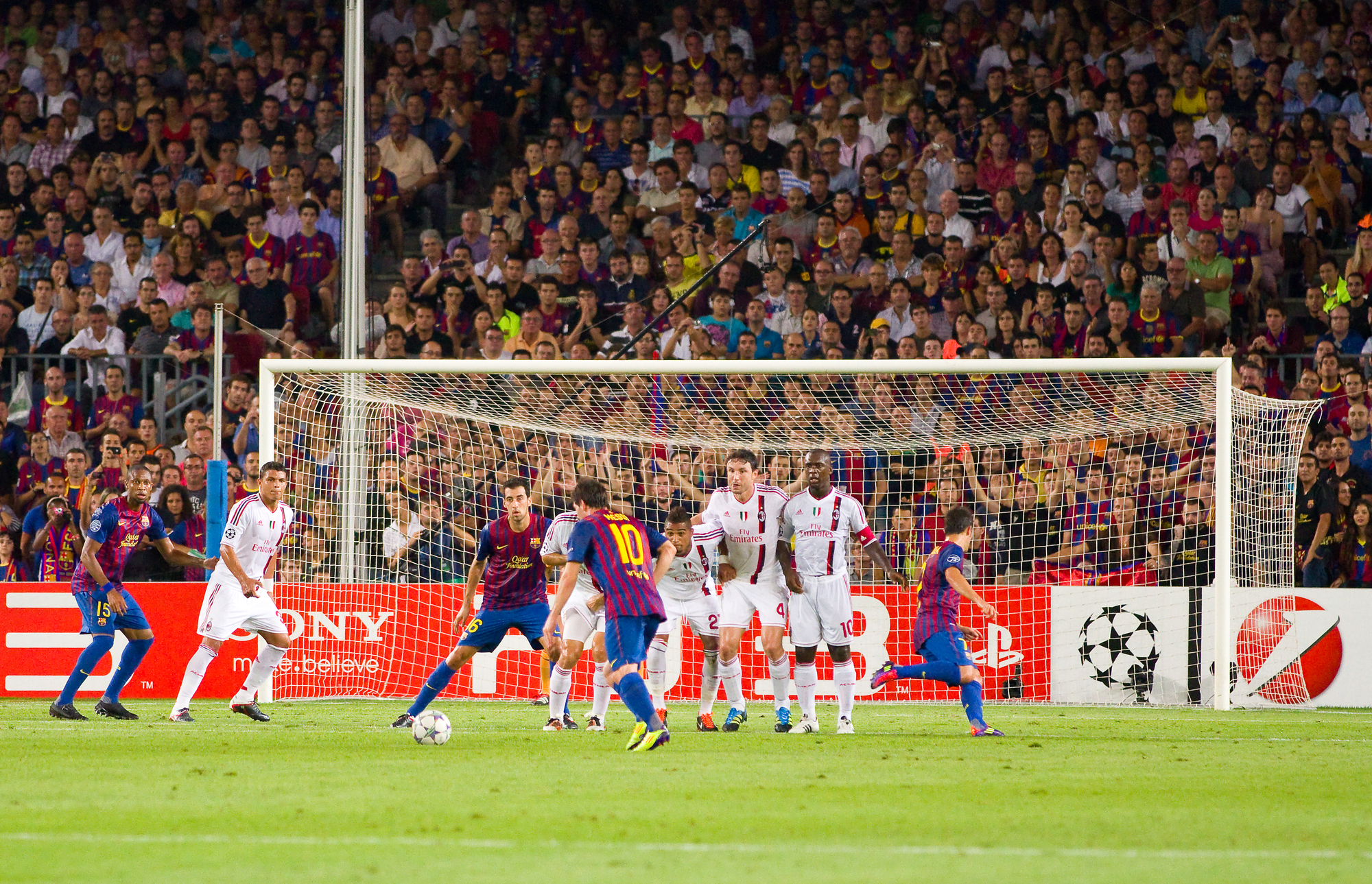 Leo Messi (10) shoots a free kick during the Champions League match between FC Barcelona and Milan, final score 2 - 2, on September 13, 2011, in Camp Nou, Barcelona, Spain.