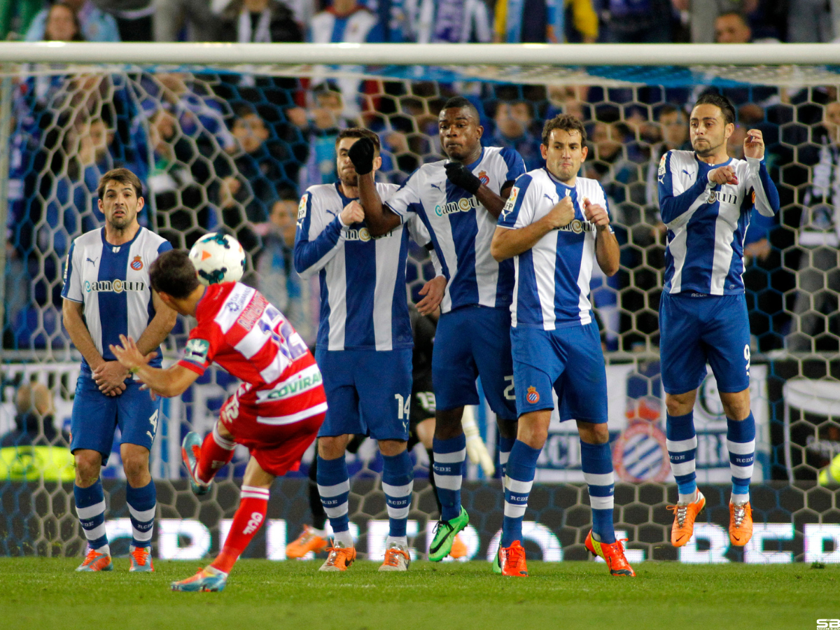 RCD Espanyol players on the wall of the free kick launched by UD Almeria during a Spanish League match at the Estadi Cornella on April 27 2014 in Barcelona Spain ○ Soccer Blade