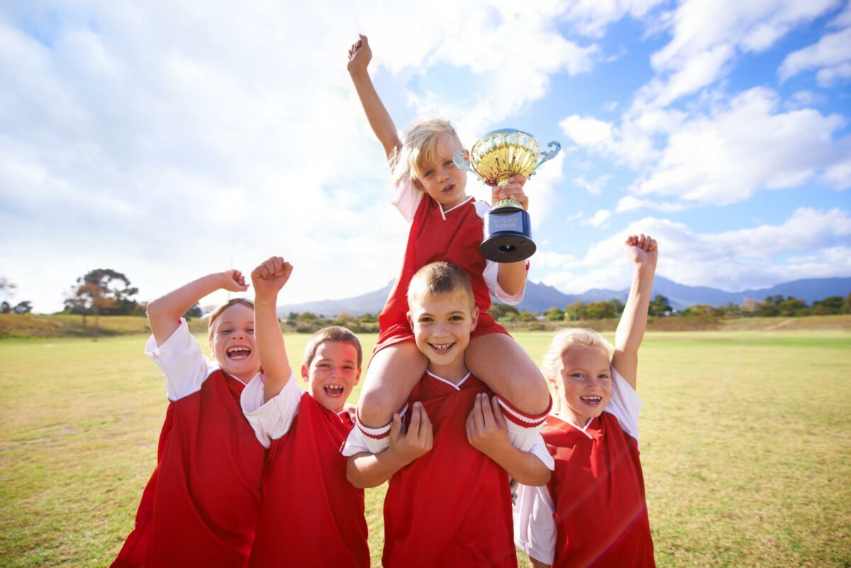 Kids soccer team celebrating their trophy ○ Soccer Blade