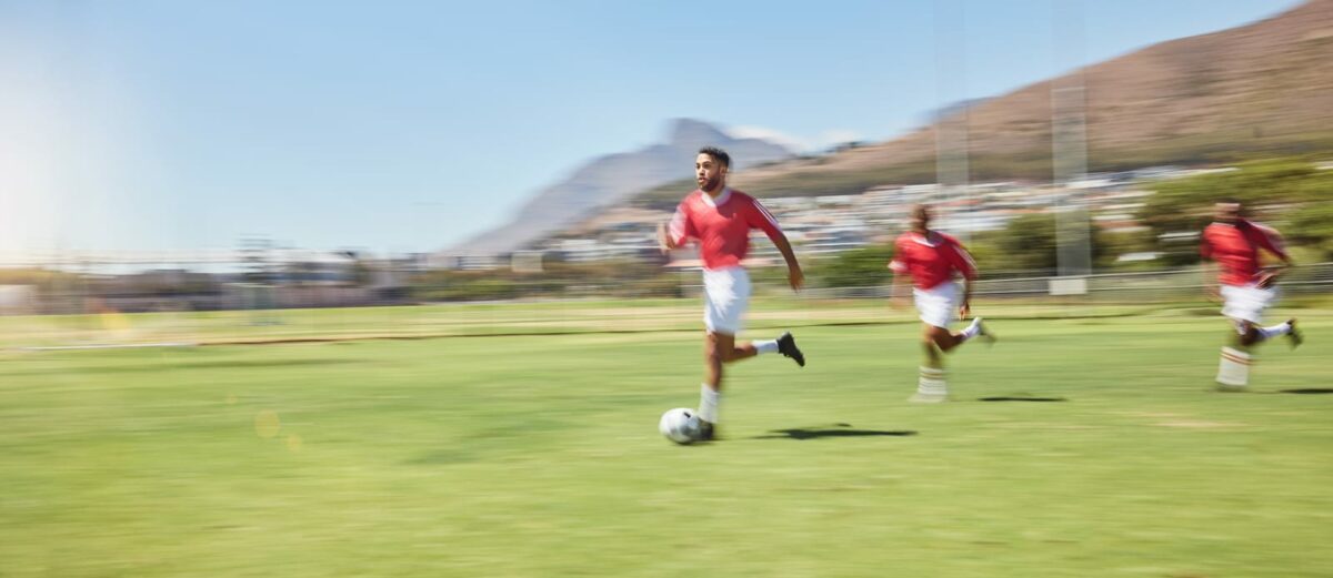 Soccer players running onto a field ○ Soccer Blade