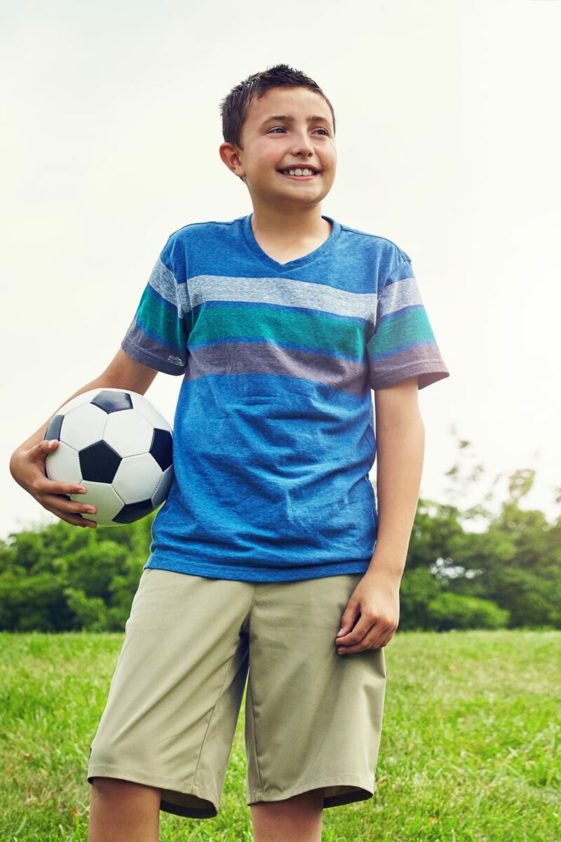 Soccer star in the making. a young boy out for a game of soccer in the park ○ Soccer Blade