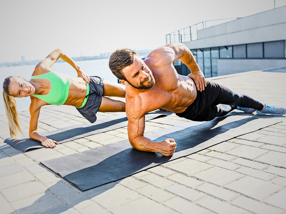 Fit fitness woman and man doing fitness exercises outdoors at city ○ Soccer Blade