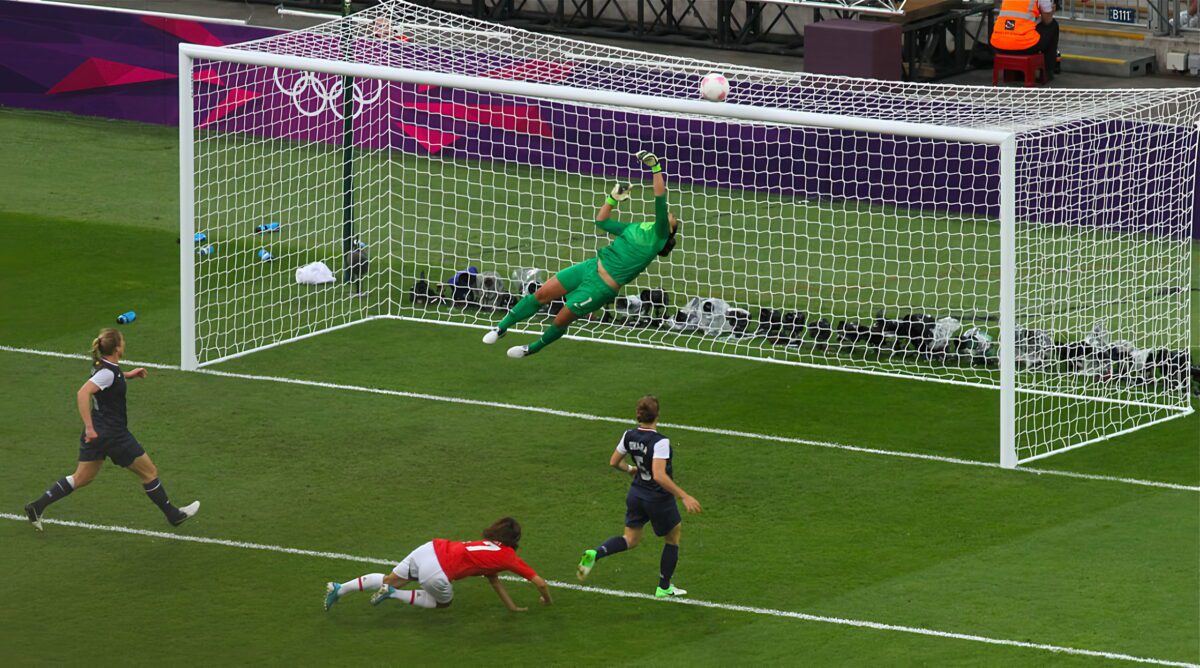 Hope Solo saves a shot from Yuki Ogimi. 2560x1426 ○ Soccer Blade