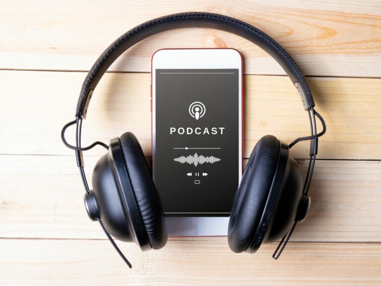 Phone Playing a Podcast with Headphones on Wood Background ○ Soccer Blade
